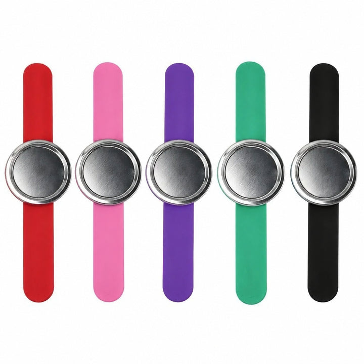 Five silicone wristbands in red, orange, purple, green, and blue, each with a brushed silver metal circular clasp, arranged in a row on a white background.