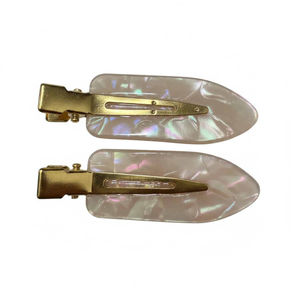 Two hair claw clips with iridescent pearlescent mother-of-pearl blades and gold-tone metal clasps, shown on a plain white background.