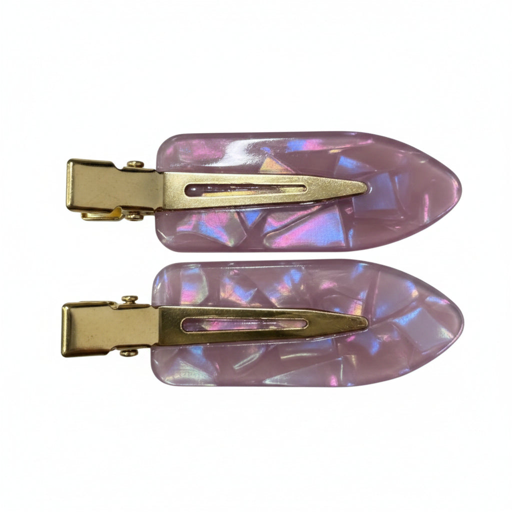 Two hair claw clips with iridescent lavender-pink resin inserts and gold-tone metal clasps, shown on a plain white background.