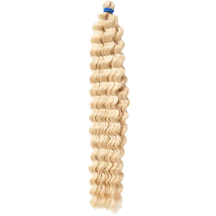 A packaged synthetic hair extension with a curly texture, branded &