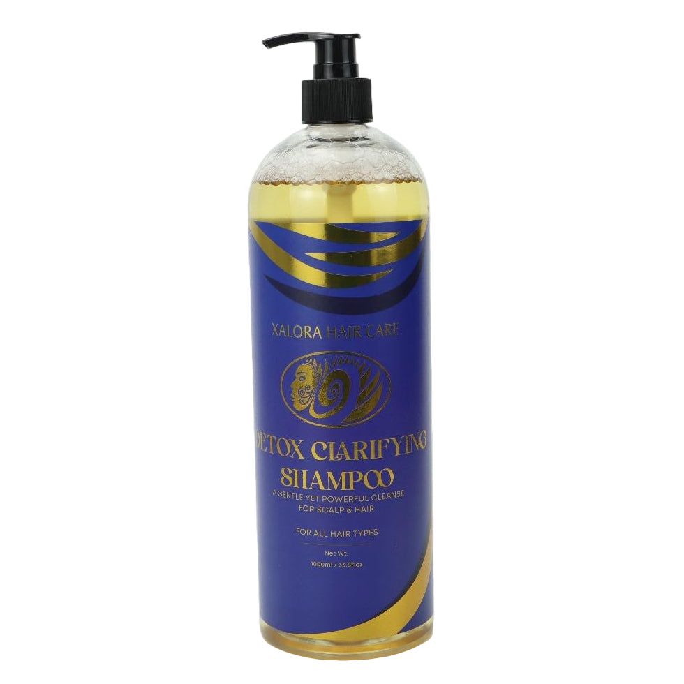 Bottle of Detox Clarifying Shampoo with blue label on a white background