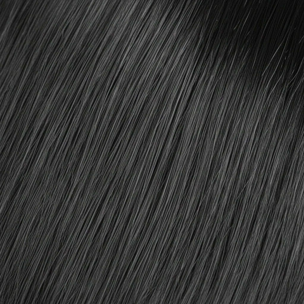 A close-up texture shot of straight, glossy black hair with soft waves, filling the entire frame.