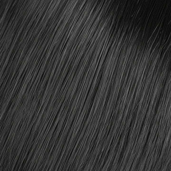 A close-up texture shot of straight, glossy black hair with soft waves, filling the entire frame.