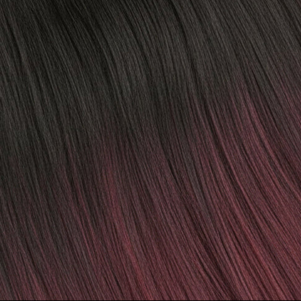 A close-up texture shot of dark, wavy hair with a deep burgundy or plum undertone.